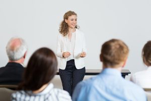 Conveyancer using soft skills like public speaking
