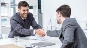 Conveyancer shaking hands with a client